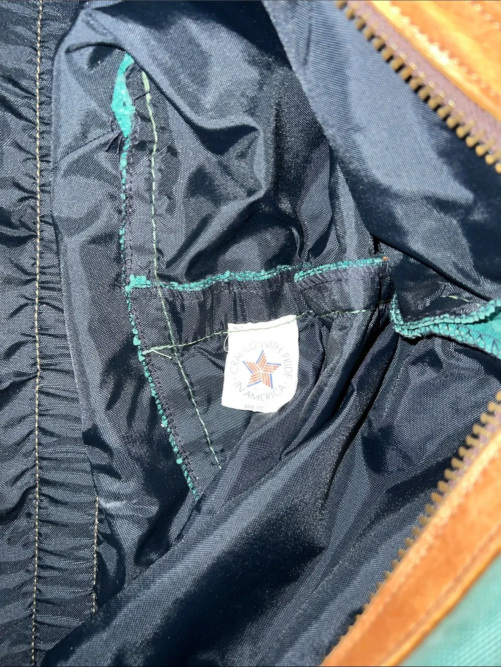 Vintage green duffle bag with leather handles